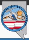 Seal of the Geological Society of Nevada featuring a geology hammer, compass, and colored stripes representing Nevada's geology.