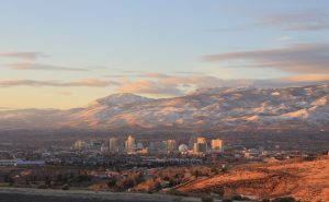 a view of a city with mountains in the background
